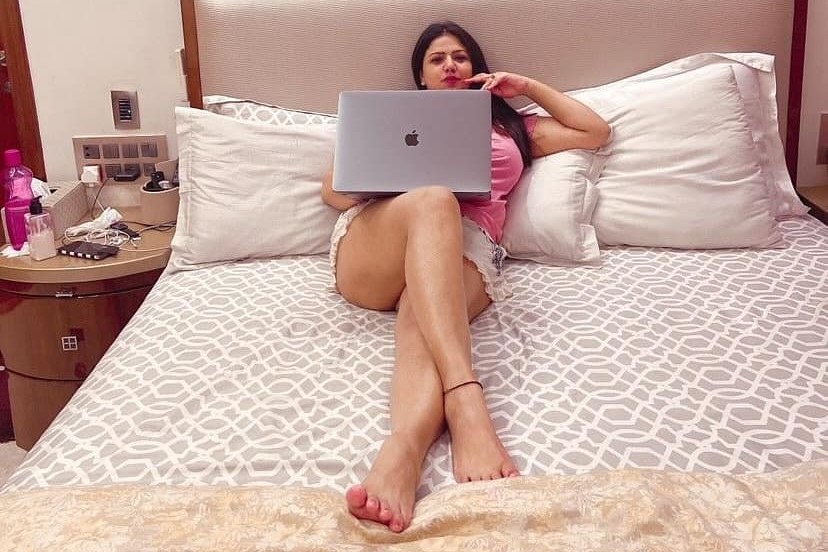 an escort using her laptop